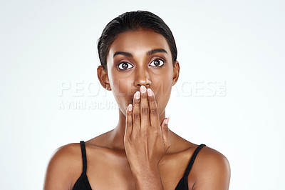 Buy stock photo Studio shot of a beautiful young woman looking surprised against a light background