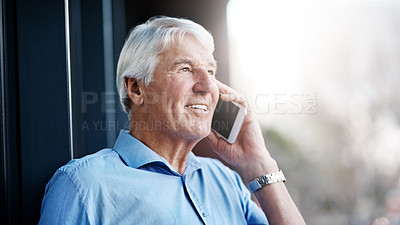 Buy stock photo Cropped shot of a senior businessman on a call outside the office