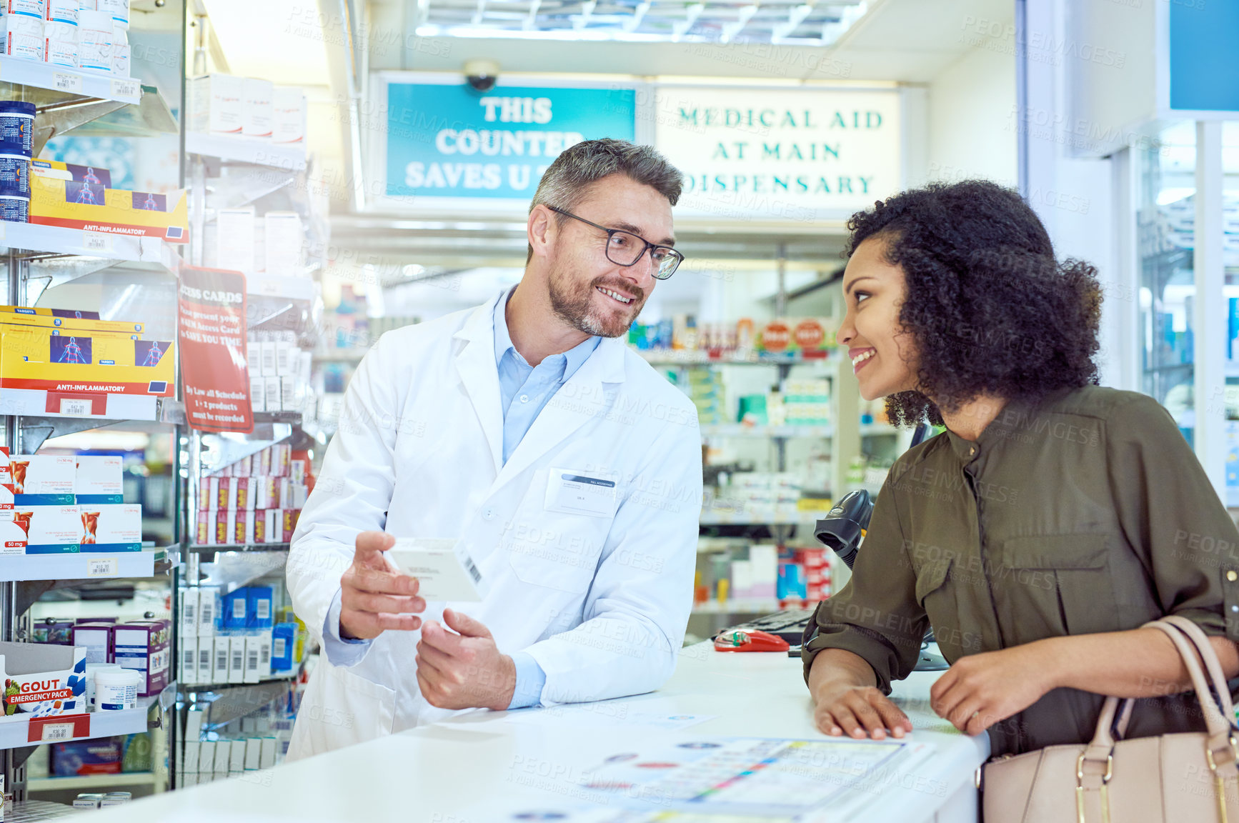 Buy stock photo Man, pharmacist and talking to customer with box for medication or healthcare advice at pharmacy. Mature medical employee consulting shopper with pharmaceutical drugs for side effects at dispensary