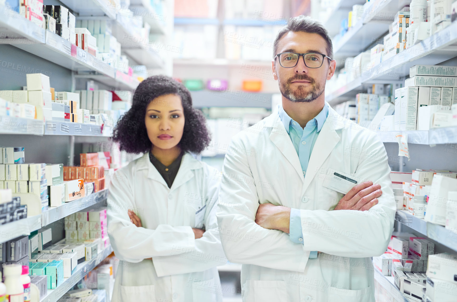 Buy stock photo Pharmacy portrait, serious and people with arms crossed for medicine, prescription and customer service. Confident, intern and pharmacist with support for pharmaceutical, healthcare and assistance