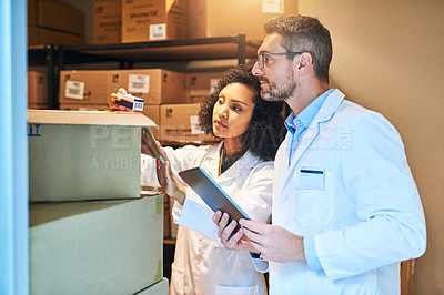 Buy stock photo Tablet, box and pharmacy with people and inventory for shipping, cargo or medical supplies. Digital, checklist and delivery with man and woman in storage room for medicine, healthcare and drugs store
