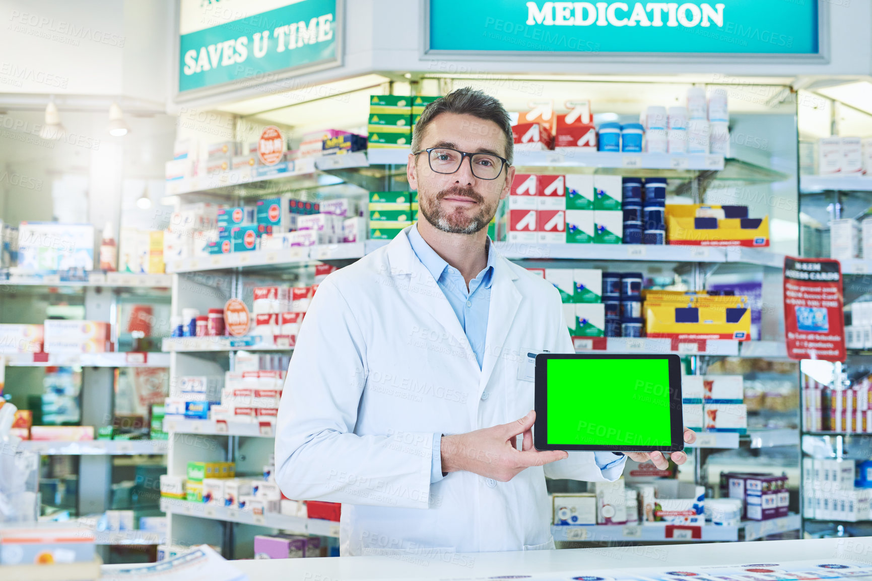 Buy stock photo Man, pharmacist and tablet with green screen in store for product, empty and pharmaceutical promo on app. Mature pharma expert, digital touchscreen and space with chromakey for mock up in portrait