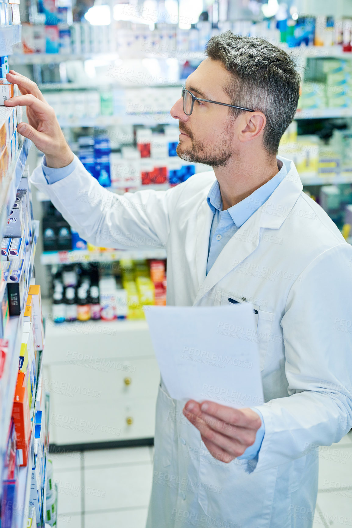 Buy stock photo Pharmacy, paper and prescription with man and shelf for pills, advice and medicine inspection. Healthcare, insurance and antibiotic search with pharmacist for inventory, drugstore and dispensary