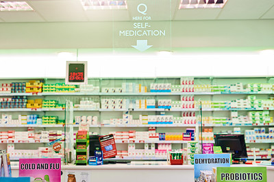 Buy stock photo Shot of shelves stocked with various medicinal products in a pharmacy