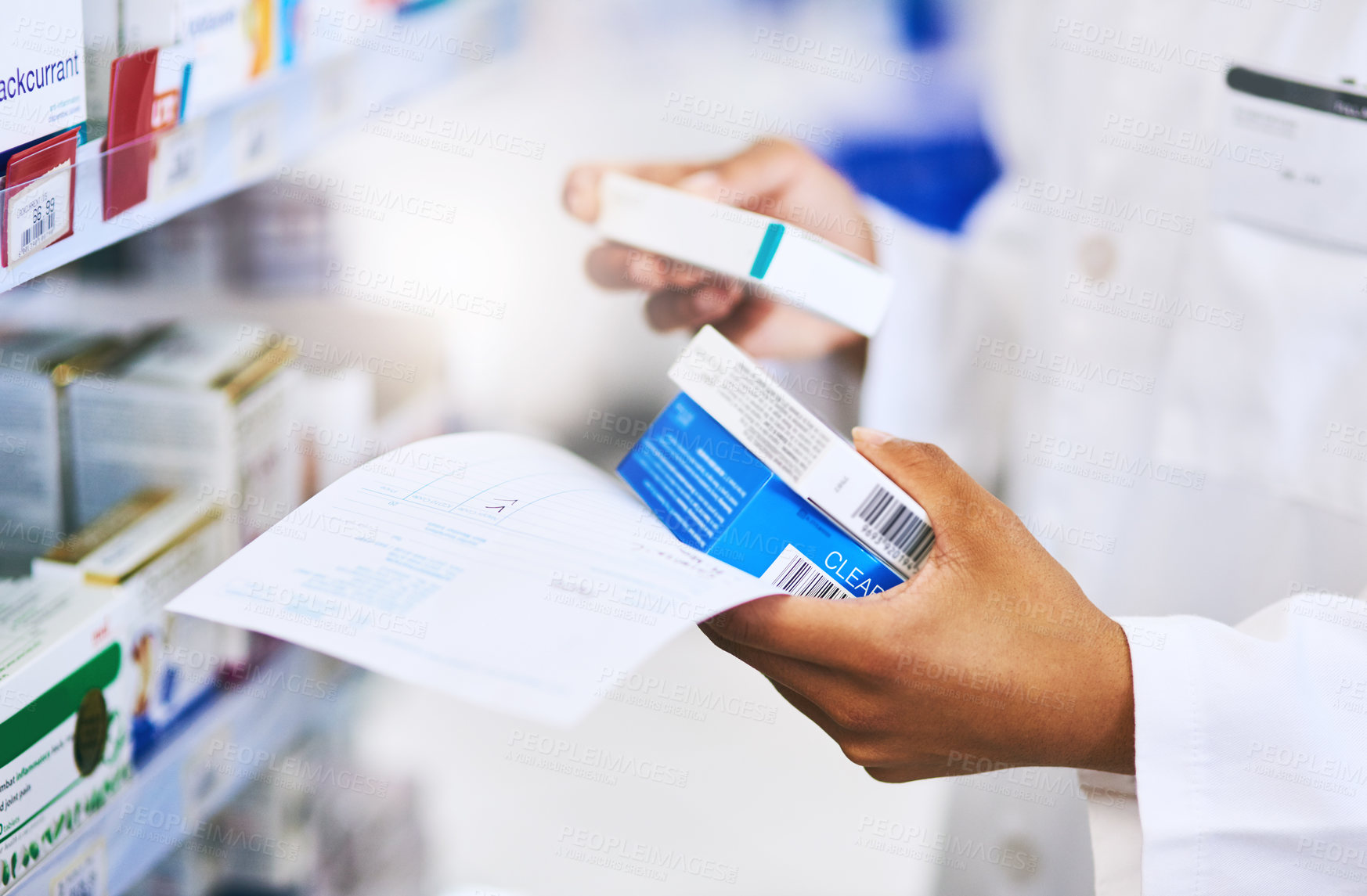 Buy stock photo Cropped shot of a pharmacist filling a prescription