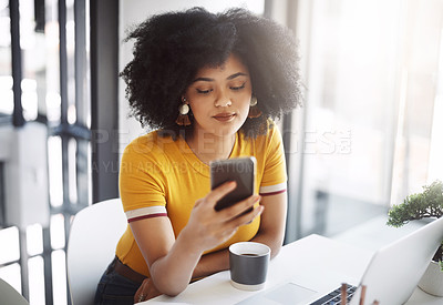 Buy stock photo Cropped shot of a beautiful young female designer using a cellphone in her home office