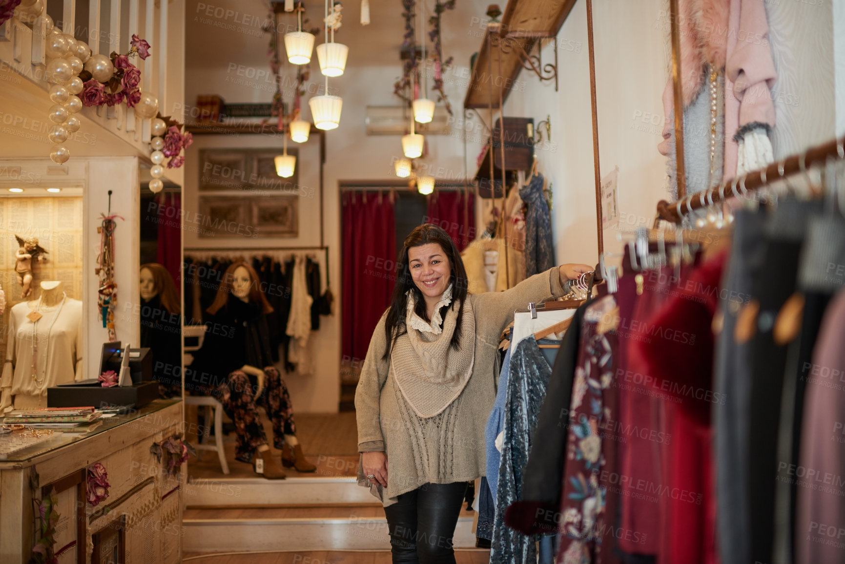 Buy stock photo Cropped portrait of an attractive mature female entrepreneur standing in her self-owned boutique