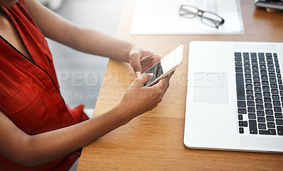 Buy stock photo Cropped shot of an unrecognizable businesswoman using a cellphone in her home office