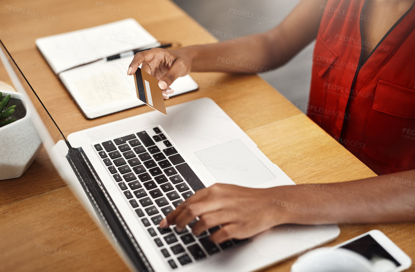 Buy stock photo Cropped shot of an unrecognizable businesswoman shopping online in her home office