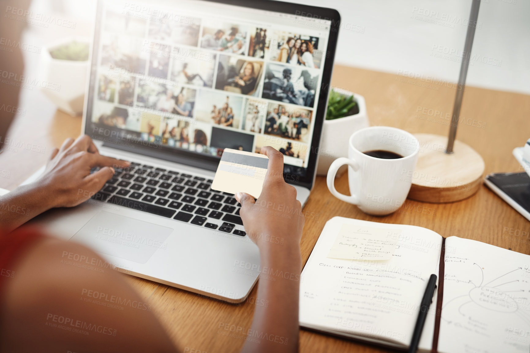 Buy stock photo Cropped shot of an unrecognizable woman shopping online in her home office