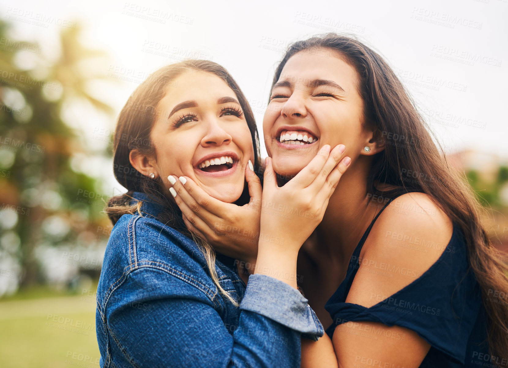 Buy stock photo Cropped shot of two female best friends hanging out in a public park