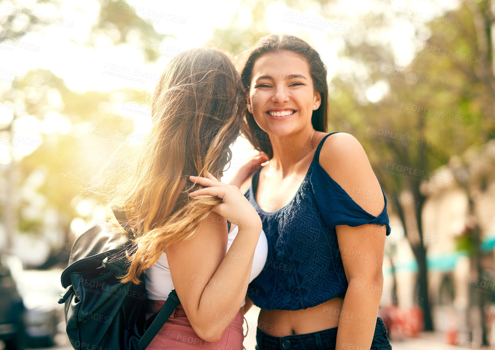 Buy stock photo Cropped shot of two female best friends hanging out in the city