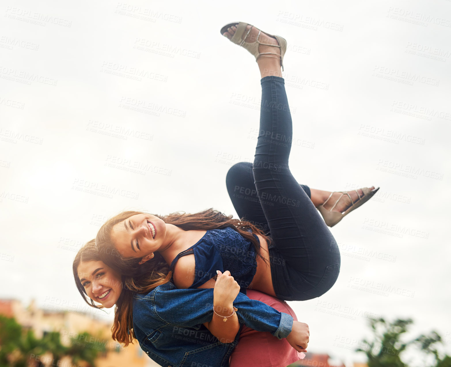 Buy stock photo Girl friends, smile and carry game for adventure, travel and bonding together in Miami park. Freedom, playful and women with laugh, happy and portrait on vacation for urban summer holiday or weekend