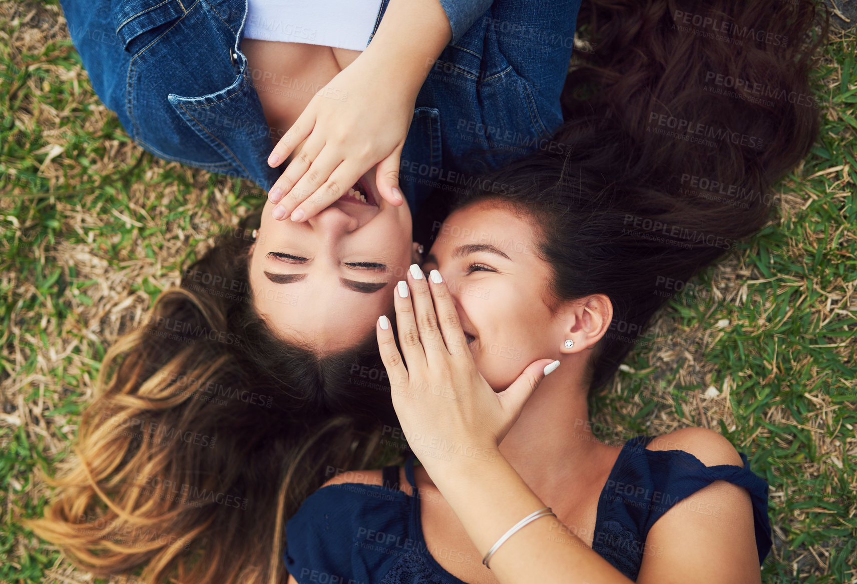 Buy stock photo High angle shot of two female best friends spending the day in a public park