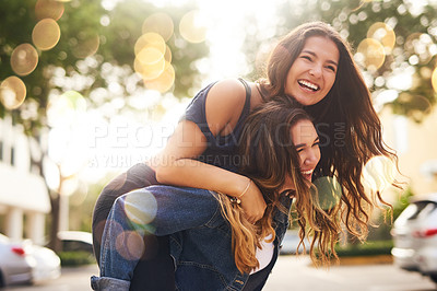 Buy stock photo Cropped shot of two female best friends spending the day together in the city