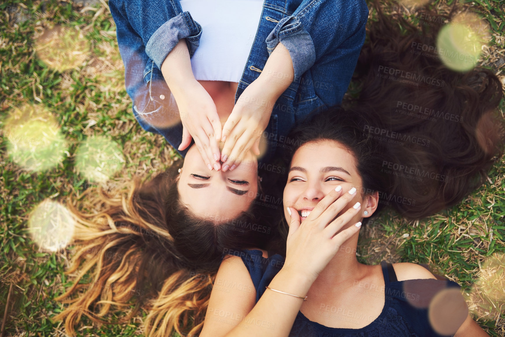 Buy stock photo High angle shot of two female best friends spending the day in a public park