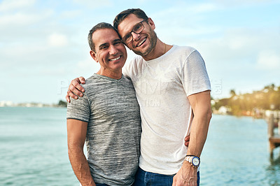 Buy stock photo Portrait, ocean and hug with gay couple, love and bonding together with romance, travel and honeymoon. Queer people, face and men with embrace, tourism and beach with adventure, relationship and Bali