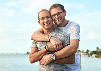 Buy stock photo Portrait of an affectionate mature couple spending the day by the beach