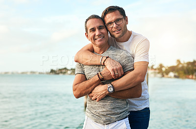 Buy stock photo Portrait, beach and hug with gay couple, travel and bonding together with romance, journey and Bali. Queer people, face and men with embrace, Bali and ocean with adventure, relationship and tourism