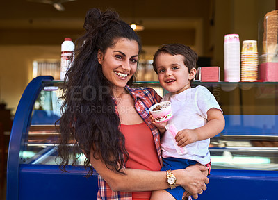 Buy stock photo Cropped portrait of an attractive young woman and her young son at an ice cream shop
