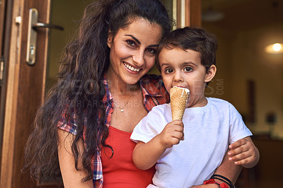 Buy stock photo Cropped portrait of an attractive young woman and her young son at an ice cream shop