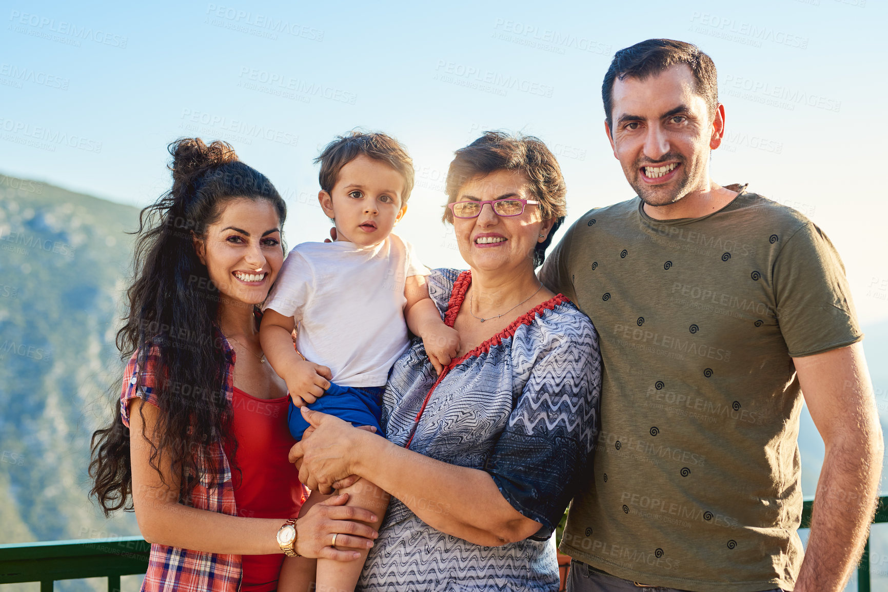 Buy stock photo Cropped portrait of an affectionate family of four standing outside
