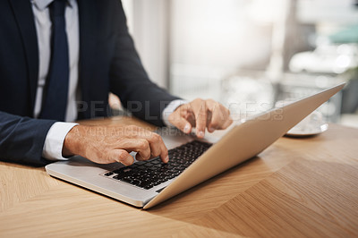Buy stock photo Closeup shot of an unrecognizable businessman working on a laptop in an office