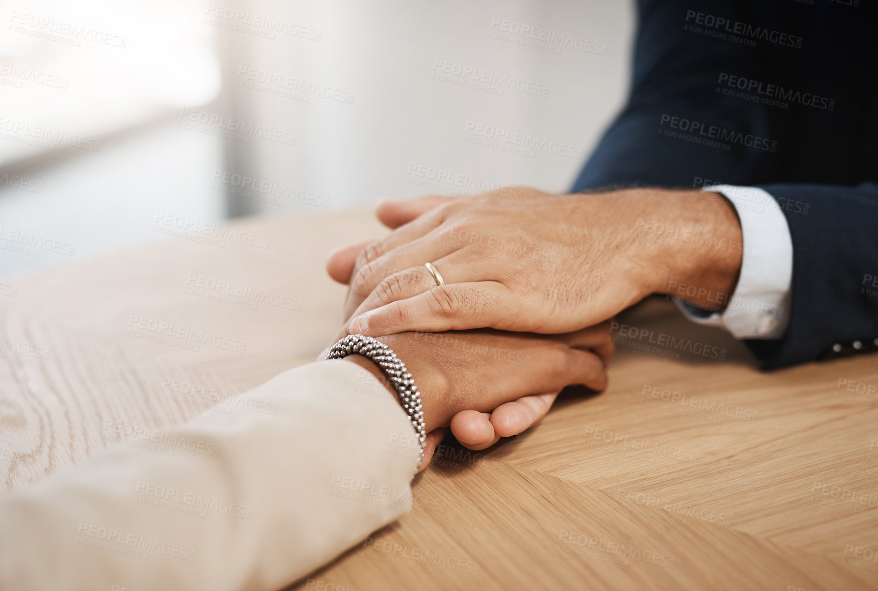 Buy stock photo Closeup shot of two unrecognizable businesspeople holding hands in an office