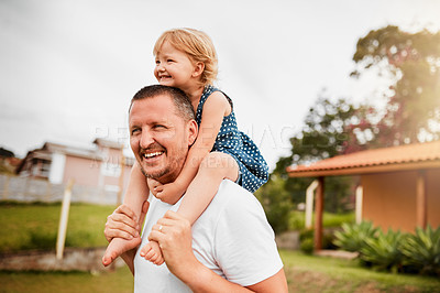 Buy stock photo Cropped shot of a mature man carrying his young daughter on his shoulders outside