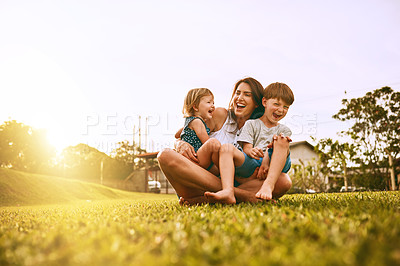 Buy stock photo Cropped shot of a young family spending time together outdoors