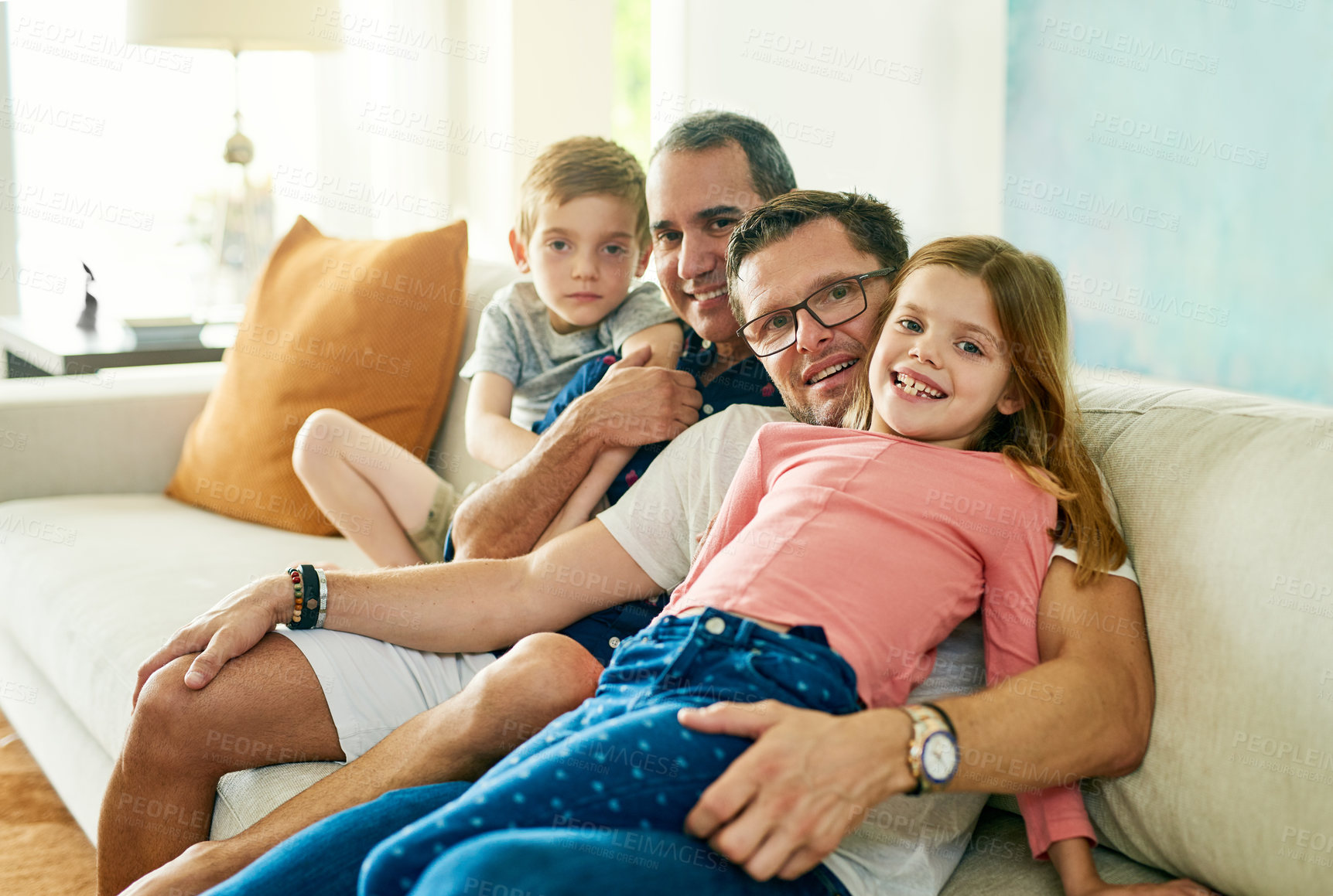Buy stock photo Cropped portrait of an affectionate family of four on the sofa at home