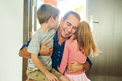 Buy stock photo Cropped shot of a mature man greeting his kids at the front door after arriving home from work