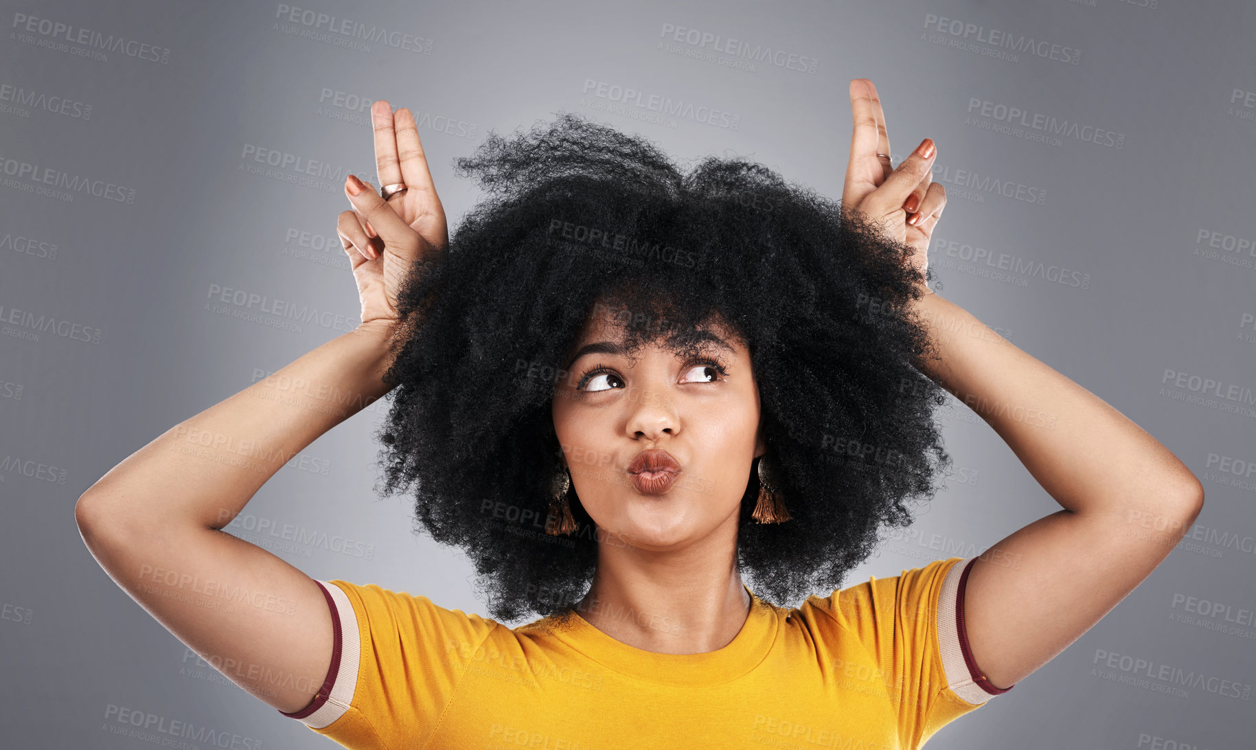 Buy stock photo Hair, beauty and woman in studio with bunny ears, freedom and fun, personality or goofy mood on grey background. Haircare, volume and gen z model with peace, hands or V sign, comic or silly gesture