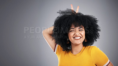 Buy stock photo Woman, peace sign and portrait of fashion, aesthetic and smile for clothes, stylish and confidence of girl. Afro, happy and female person with gesture, tshirt and pride with hair for model in studio