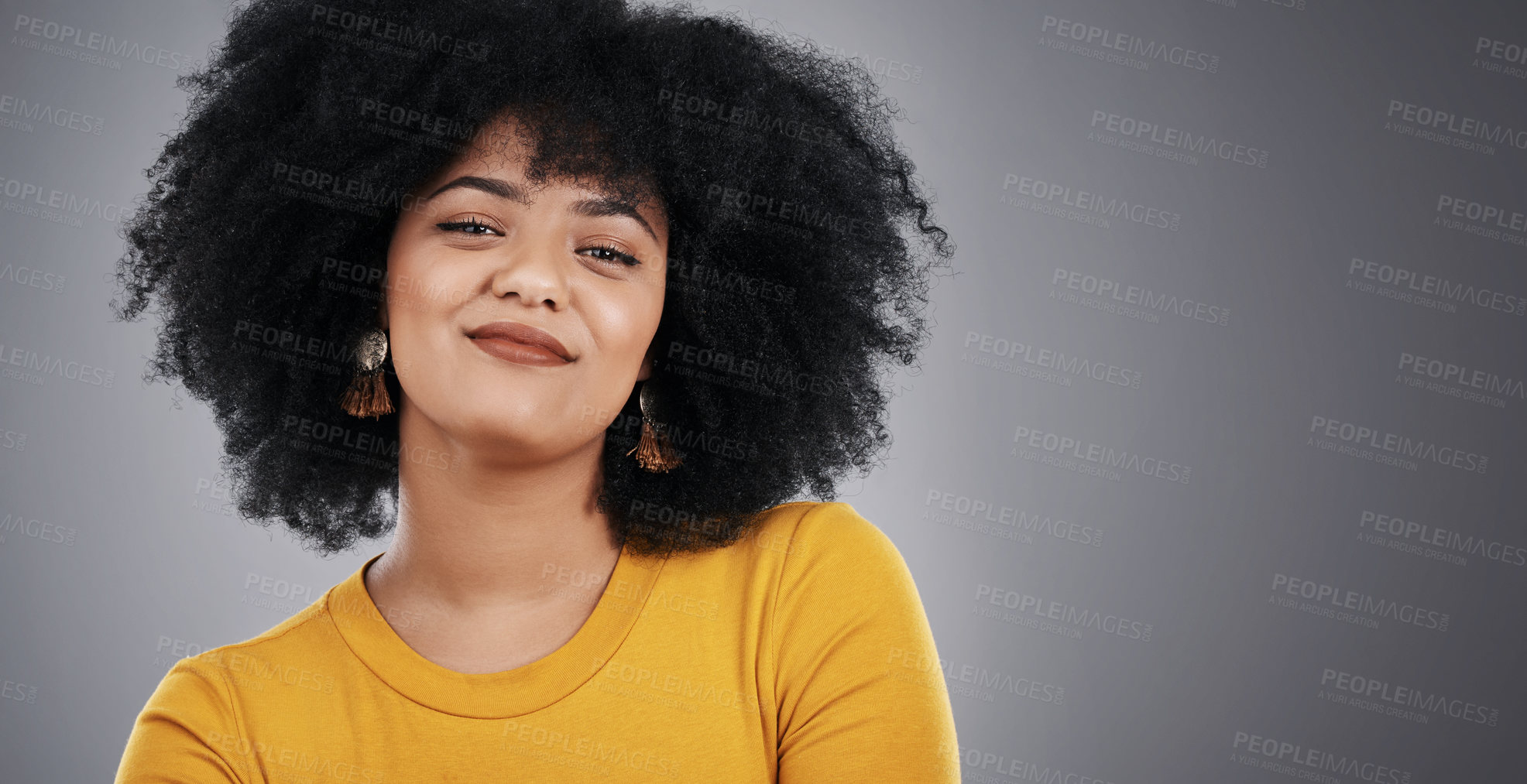 Buy stock photo Woman, afro and portrait of fashion, smile and clothes for style, confidence and happiness for girl. Tshirt, background and person with pride, relax and hair for model, cool and aesthetic for studio