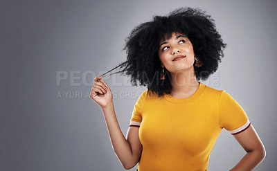 Buy stock photo African woman, thinking and hair in studio for with ideas for natural texture, care and growth on gray background. Curly girl, model or person with hairstyle tips, choice and decision or solution