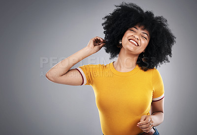 Buy stock photo Natural, afro and woman in studio, happy and soft with shine, hair and healthy with treatment. Healthcare, aesthetic and grey background for mockup, beauty and self care for girl, pride and confident