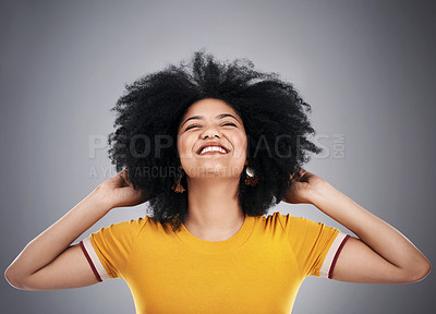 Buy stock photo Studio, afro and happy woman with casual fashion, gen z girl with positive attitude, relax and excited. Smile, cool style and female person on grey background with opportunity, confidence and pride