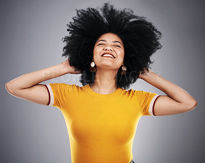 Buy stock photo Natural, afro hair and happy woman dance in studio with shampoo, volume or treatment results on grey background. Haircare, beauty and model excited for growth cosmetics, texture or shine satisfaction