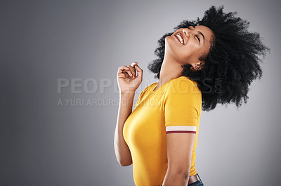 Buy stock photo Afro hair, natural and happy woman dance in studio with shampoo, volume or treatment results on grey background. Haircare, beauty and model excited for growth cosmetics, texture or shine satisfaction