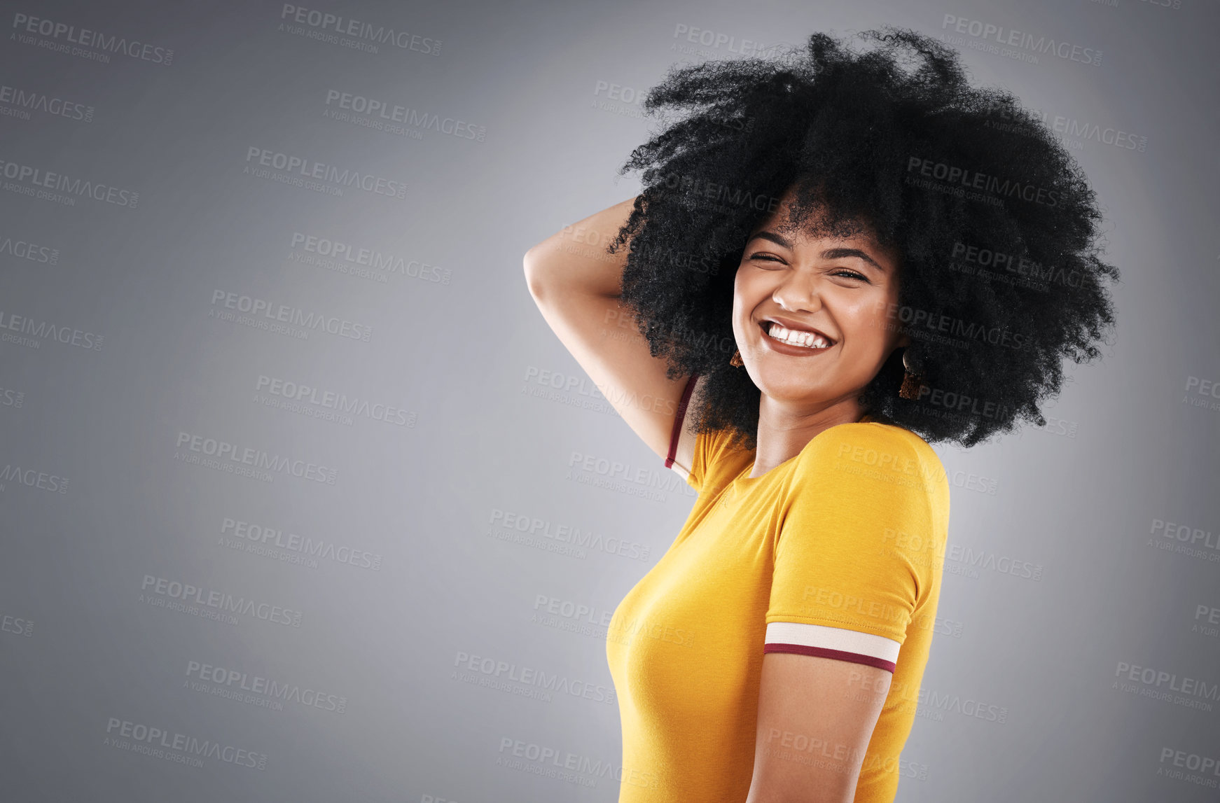 Buy stock photo Portrait, afro hair and happy woman on studio mockup for shampoo, treatment or shine results on grey background. Haircare, beauty and model smile for growth cosmetics, texture and glow satisfaction