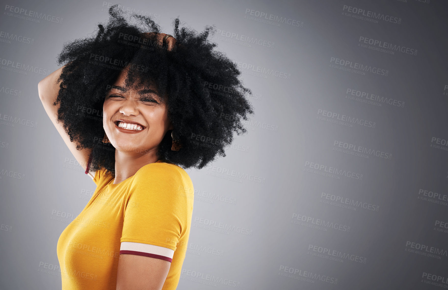 Buy stock photo Hair, mockup and portrait of happy woman in studio for afro care, shampoo or curly mousse results on grey background. Haircare, growth and model excited with texture, cosmetics or frizz promotion