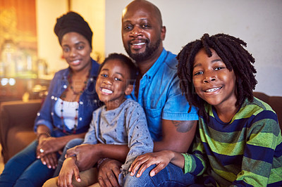 Buy stock photo Shot of a family of four spending the day at home