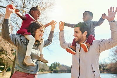 Buy stock photo Shot of a happy family bonding together outdoors
