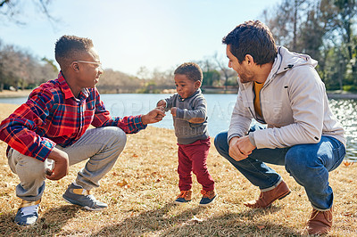 Buy stock photo Shot of a father and his two little sons bonding together outdoors
