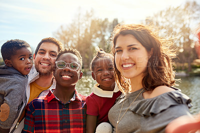 Buy stock photo Portrait of a happy family taking a selfie together outdoors