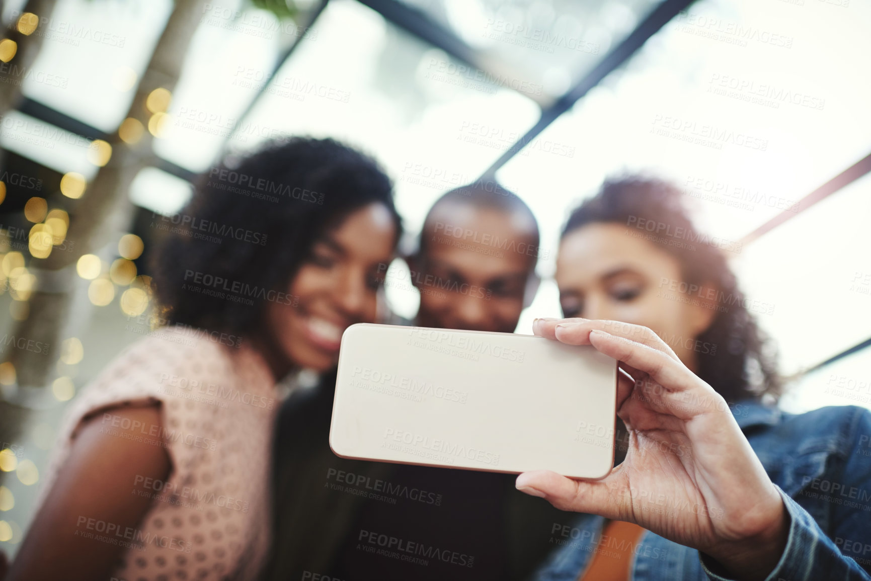 Buy stock photo Shot of a group of friends taking a selfie together on their night out