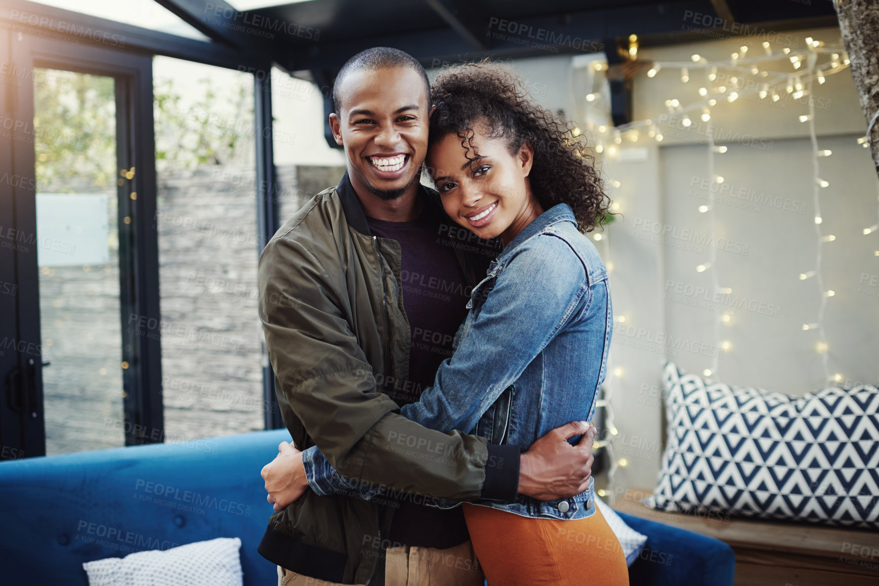 Buy stock photo Couple, portrait and smile with hug in backyard for commitment, connection and date in marriage. Woman, man and love with embrace on patio by fairy lights for summer romance, support and anniversary