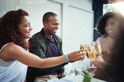 Buy stock photo Cropped shot of a group of young friends enjoying a night out
