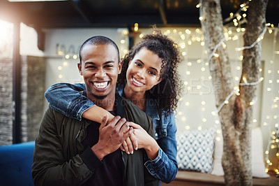 Buy stock photo Cropped shot of a happy young couple out on a date